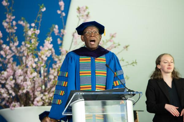 A man standing at a podium delivering a speech