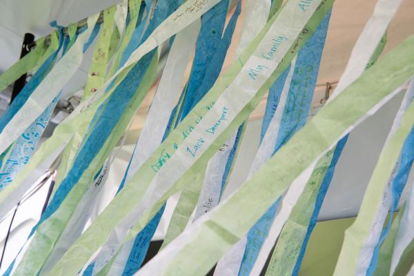 A photo of stripes of papers blowing in the winds