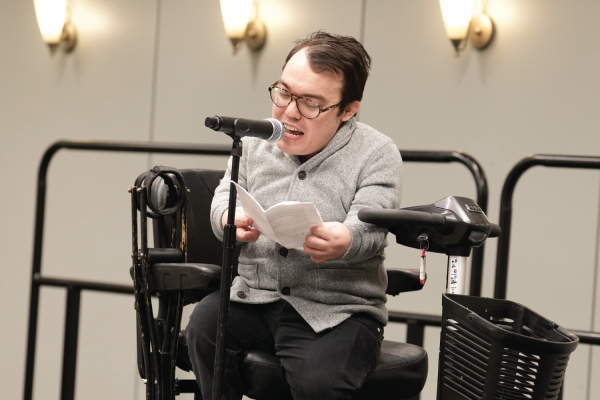 Assistant Director for STEM at Brown University’s Center for Teaching and Learning, Logan Gin, performs at AAAS conference Story Slam