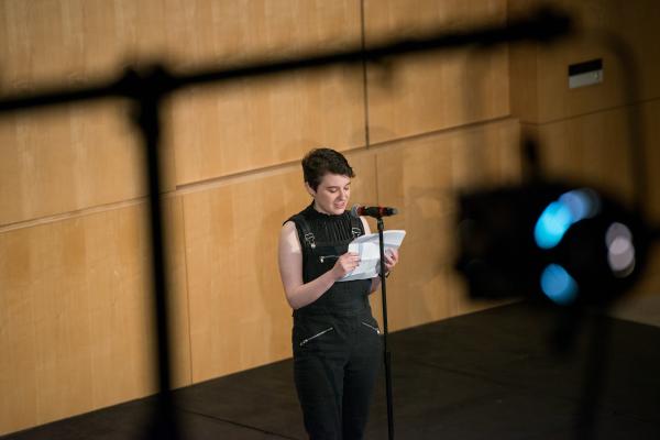 Student Micah Reid performs at Olin Community Story Slam featuring faculty, staff, and student performances