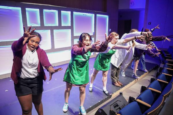 Five members of the Olin theatre group, FWOP, perform a song and dance during their fall 2024 performance.