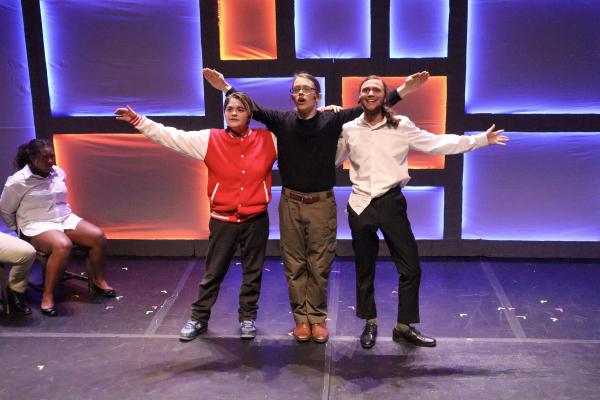 Members of FWOP take a bow on stage while performing a scene from "The Guy Who Didn't Like Musicals."