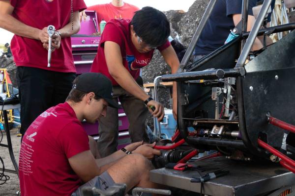 Olin Baja SP 25 - Students working on Baja car
