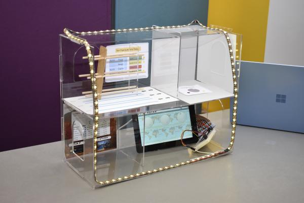 A mini model of a project featuring four rooms. 