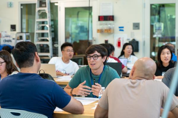 A Summer Studio attendee with their group. 