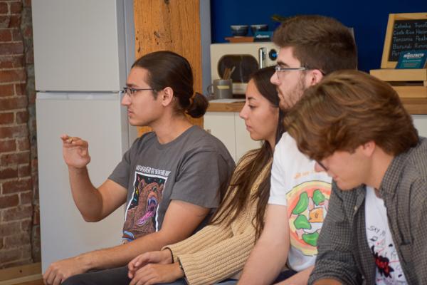 A close-up of students asking questions during Wavelength's presentation. 
