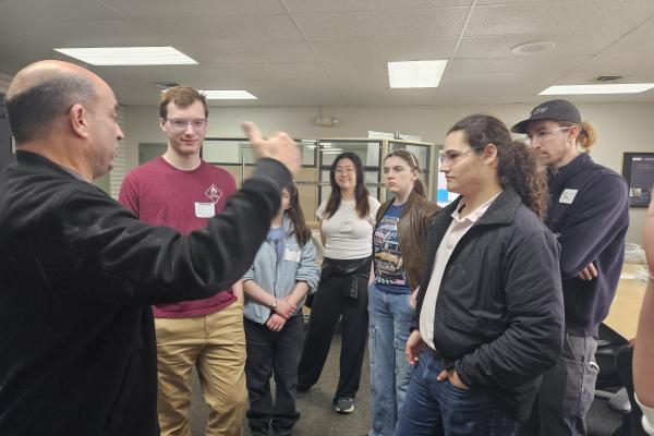 Students and staff learning about Armstrong Mold Corporation.