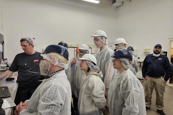 Students learning about Barilla's manufacturing process. 