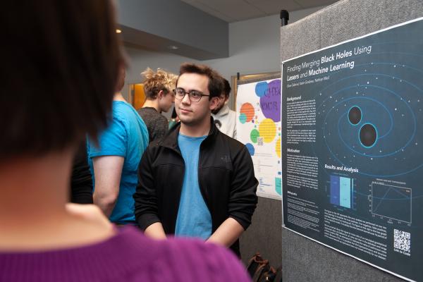 An Olin student presents their Astro Stats poster research.