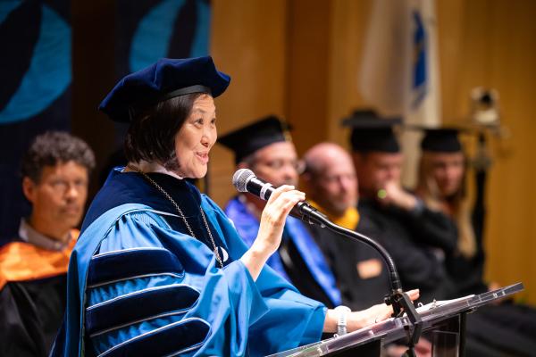 President Lee holds the microphone at her inauguration