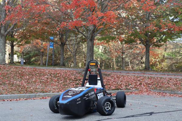 Olin Motorsports Car parked in a parking lot on campus